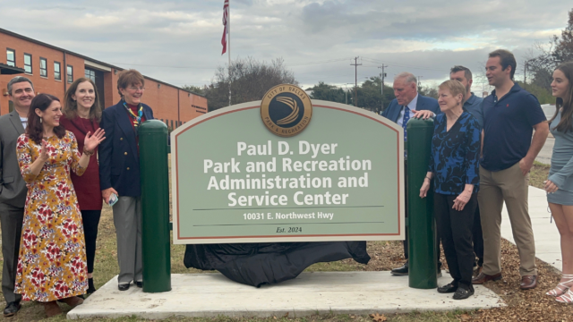 Paul D. Dyer, surrounded by his family,