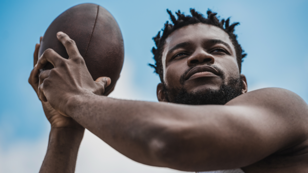 Athlete holding football