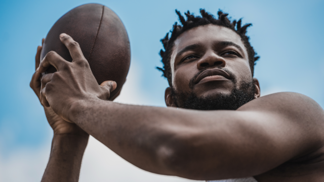 Athlete holding football