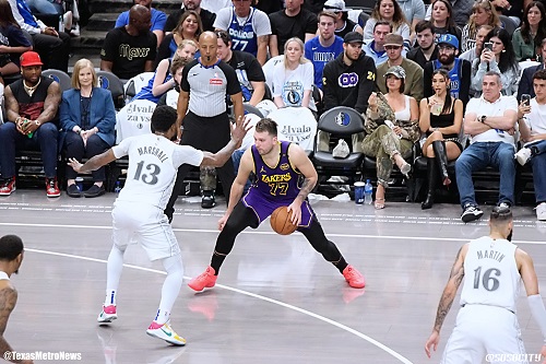 Luka prepares to shoot over Mavs' Naji Marshall